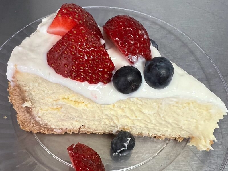 Slice of cheesecake with berries from Mountain Berry Bakery