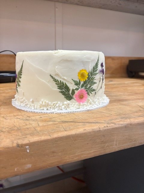 Cake decorated with a hand-painted flower