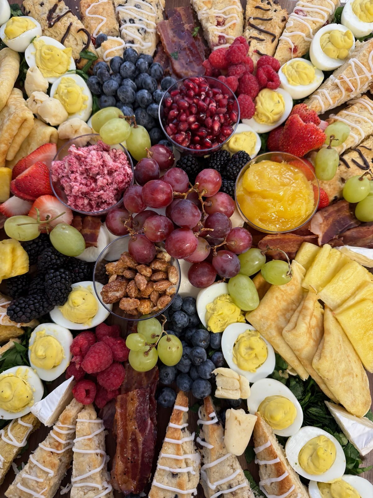 Grazing board with fruit, cheese, and crackers