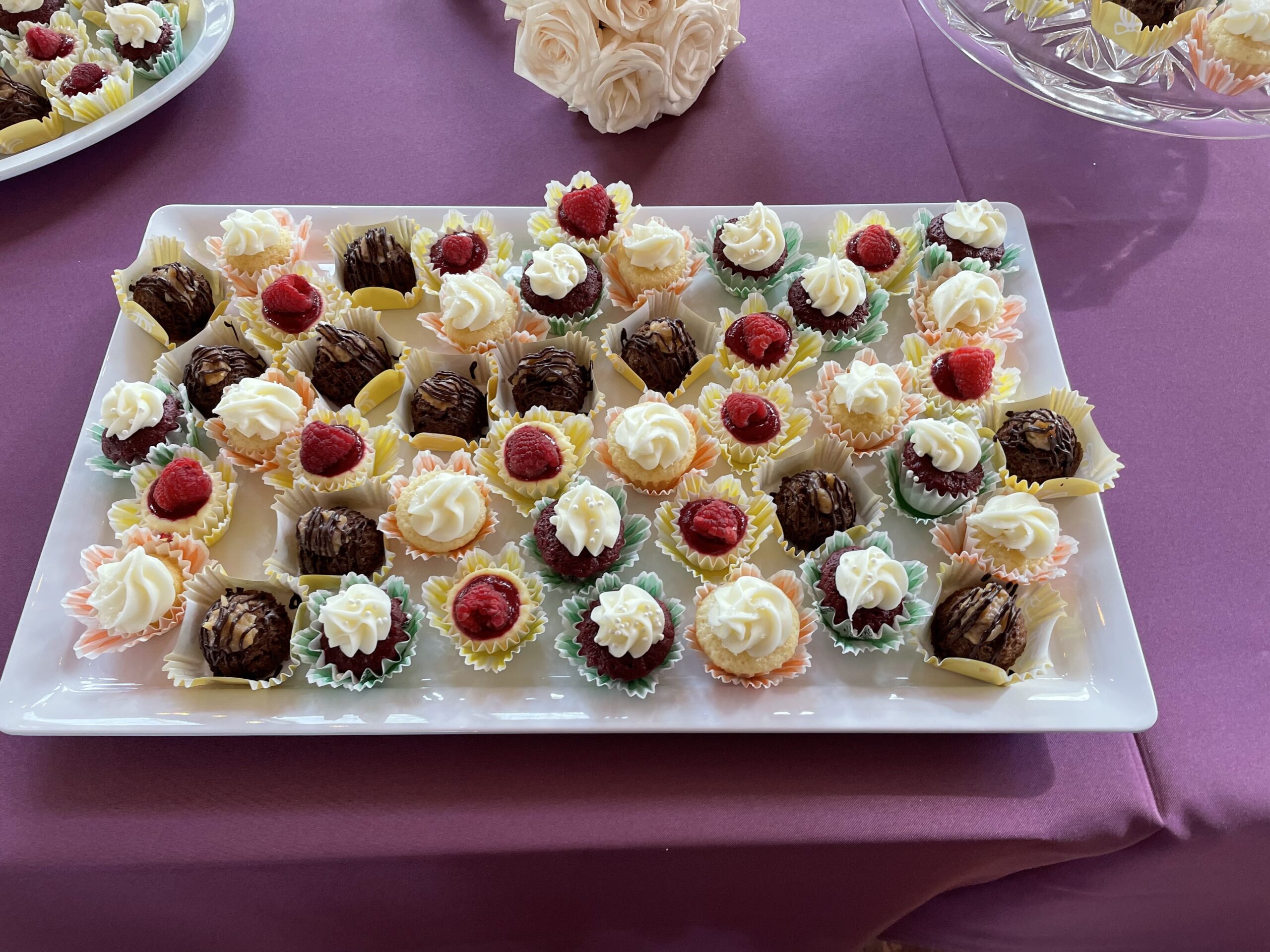 Dessert variety plate which includes petite German chocolate cake and others.